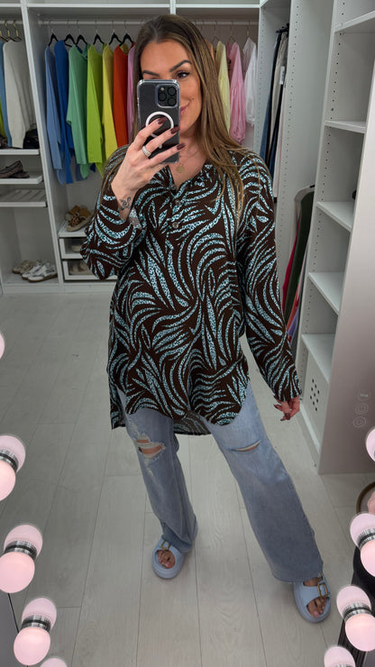 Senita Dipped Hem V Neck Blouse