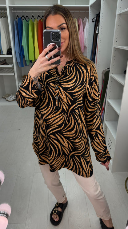 Senita Dipped Hem V Neck Blouse