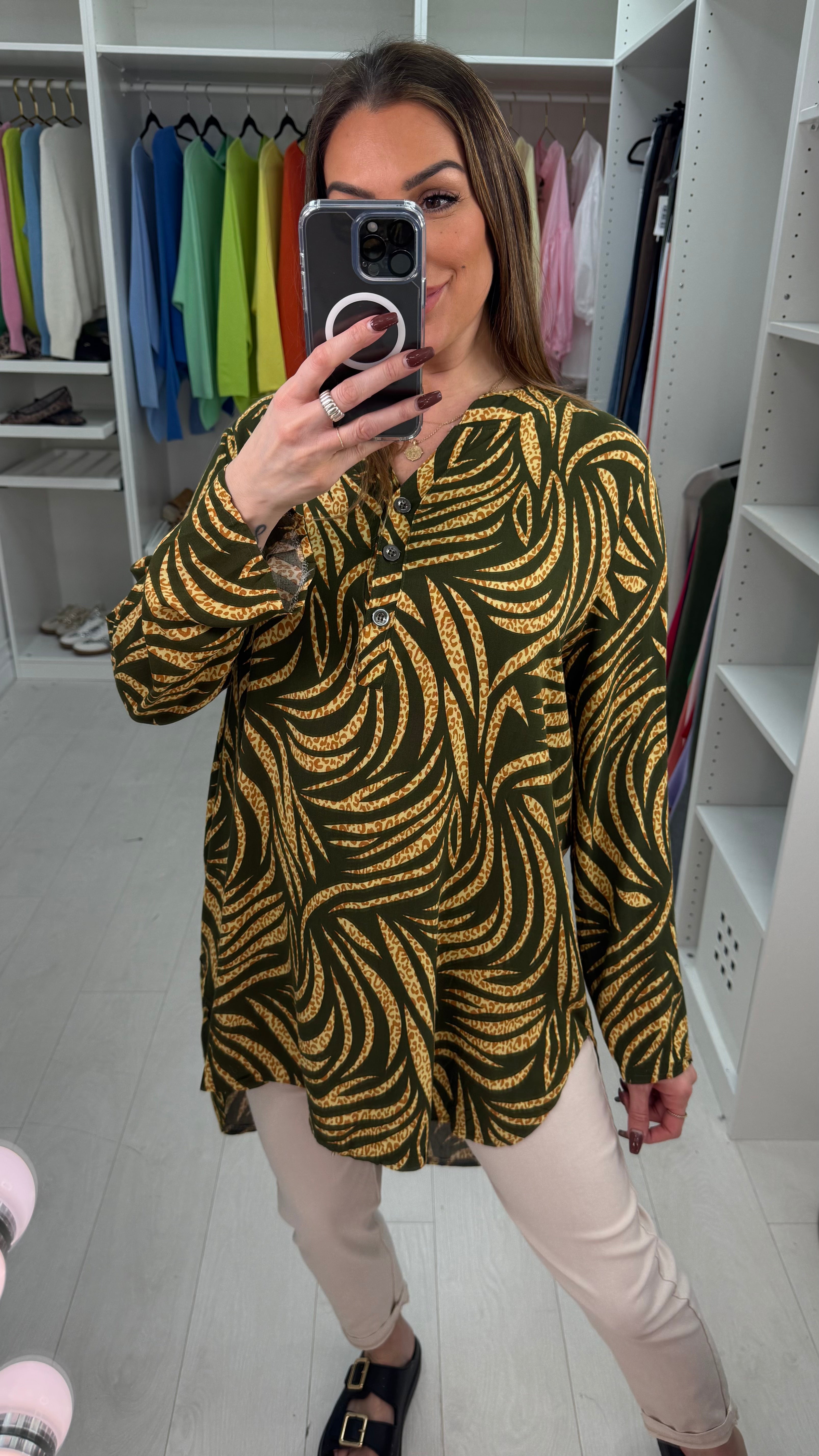 Senita Dipped Hem V Neck Blouse