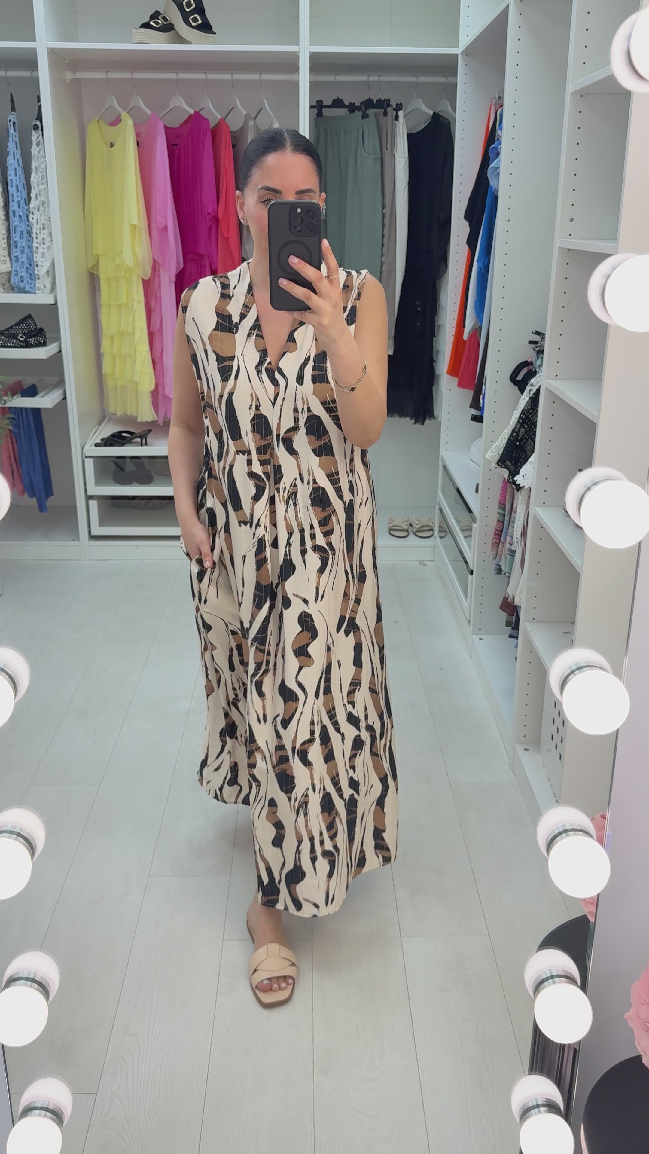 Load video: Iveta Abstract Print V Neck Sleeveless Maxi Dress