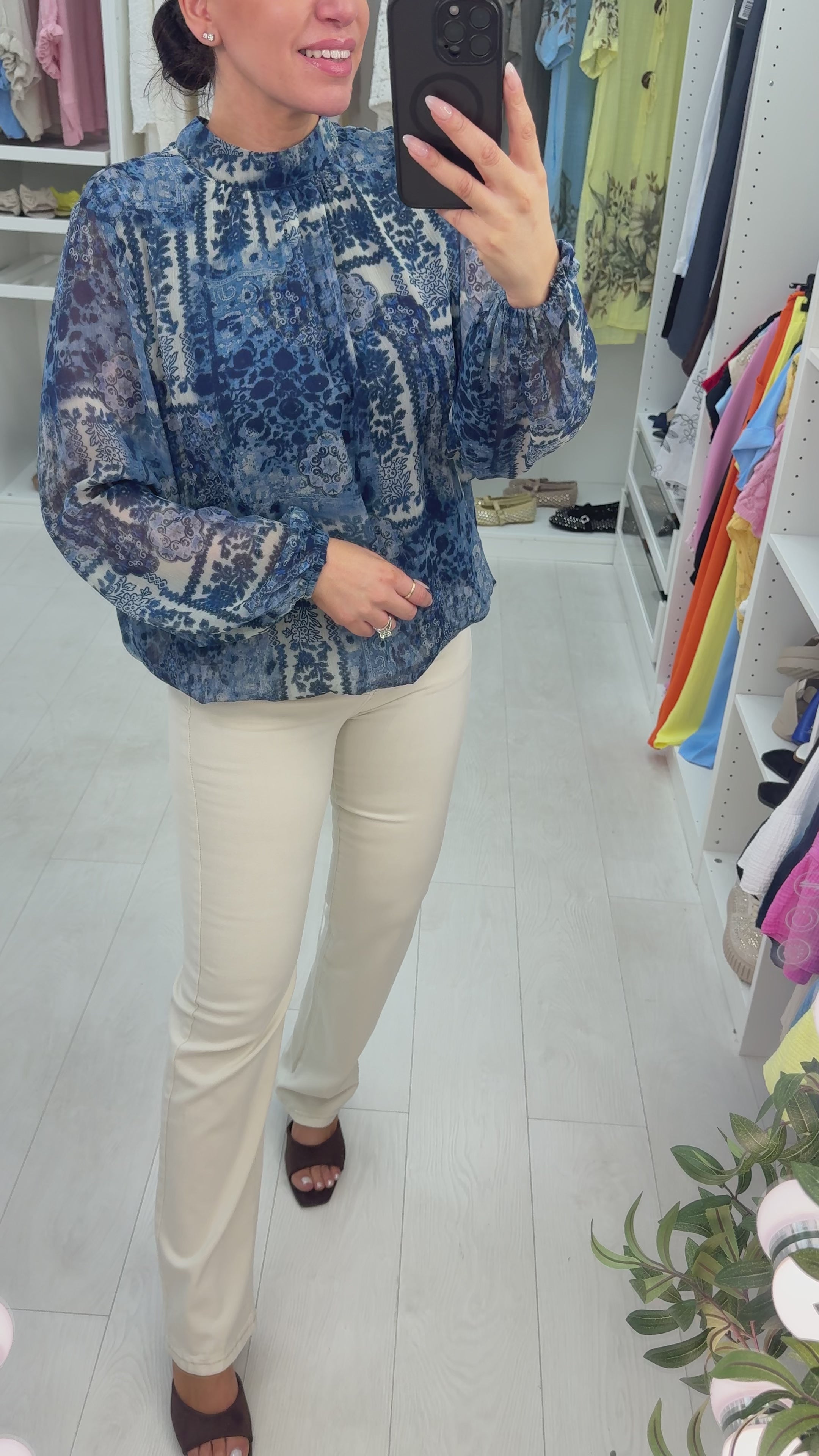 Load video: Shirley High Neck Elasticated Bubble Hem Blouse