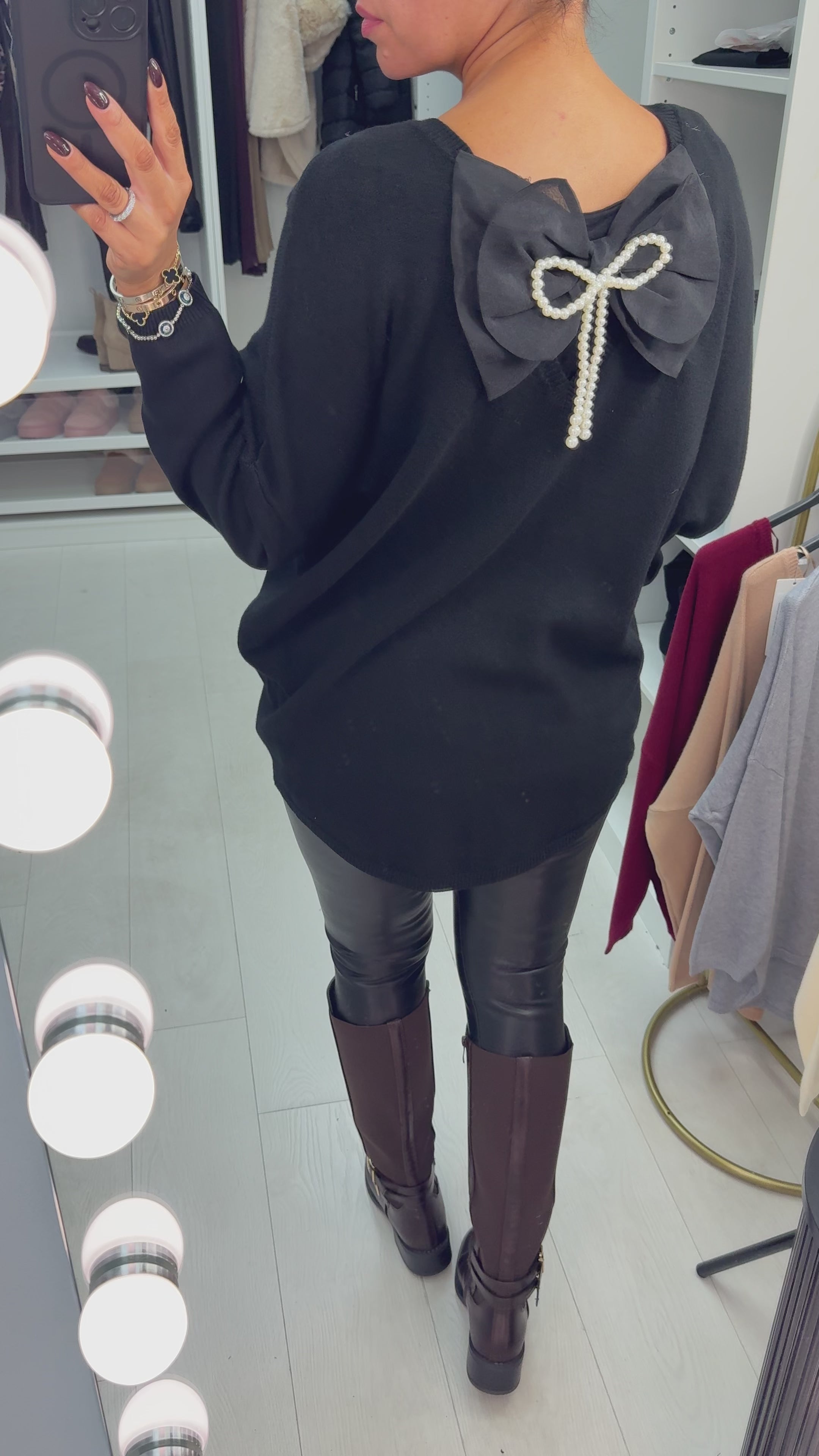 Load video: Madeline Plain V Neck Bow Back Jumper