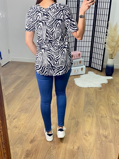 Gigi Zebra Print Dip Hem Top