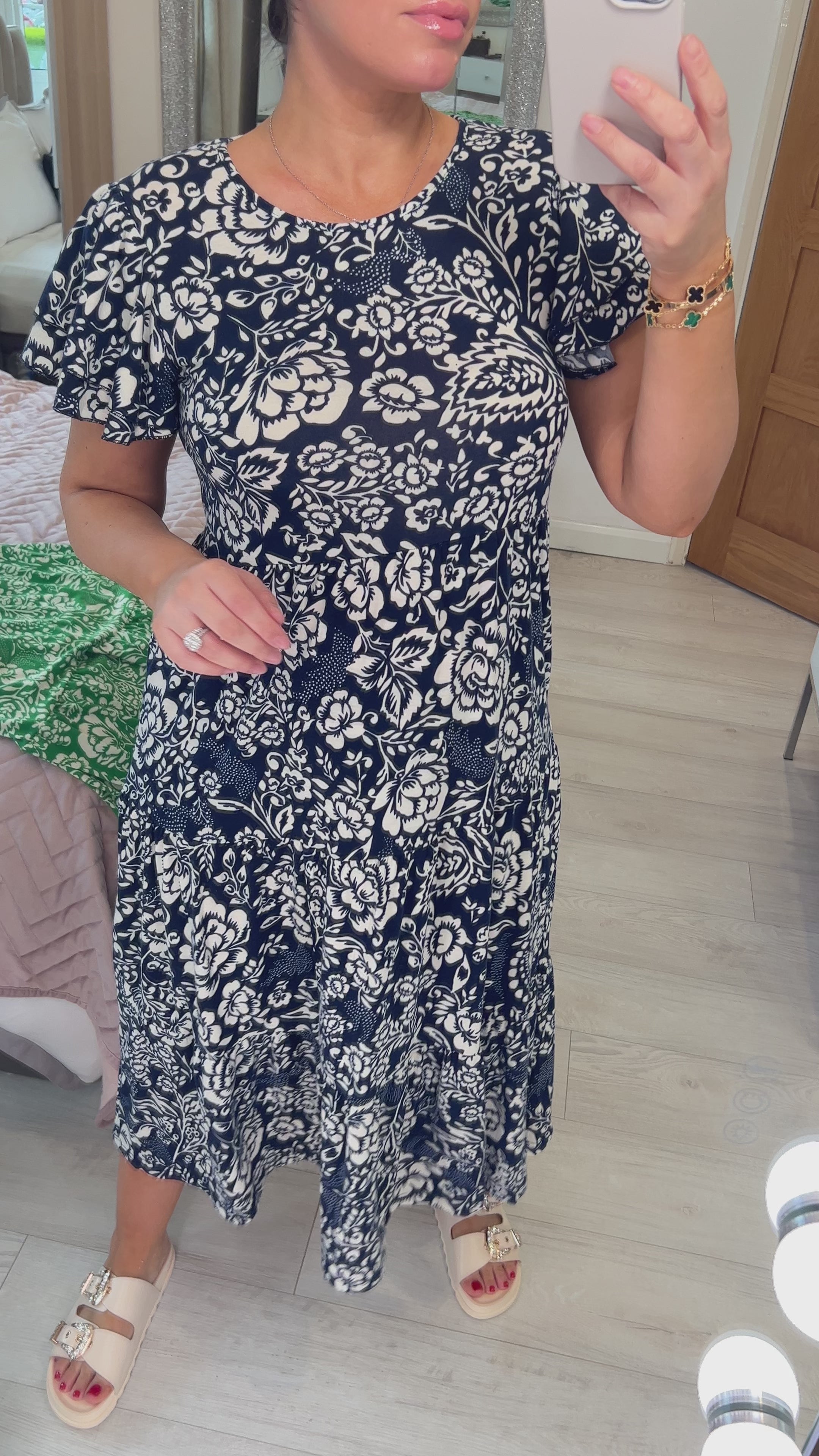 Load video: Dale Floral Print Ruffle Sleeve Tiered Midi Dress